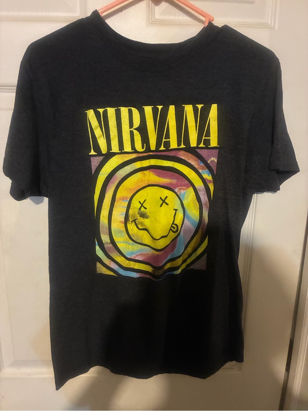 NIRVANA Black Short-Sleeve Tee with Yellow Logo and Multicolor Swirl Smiley